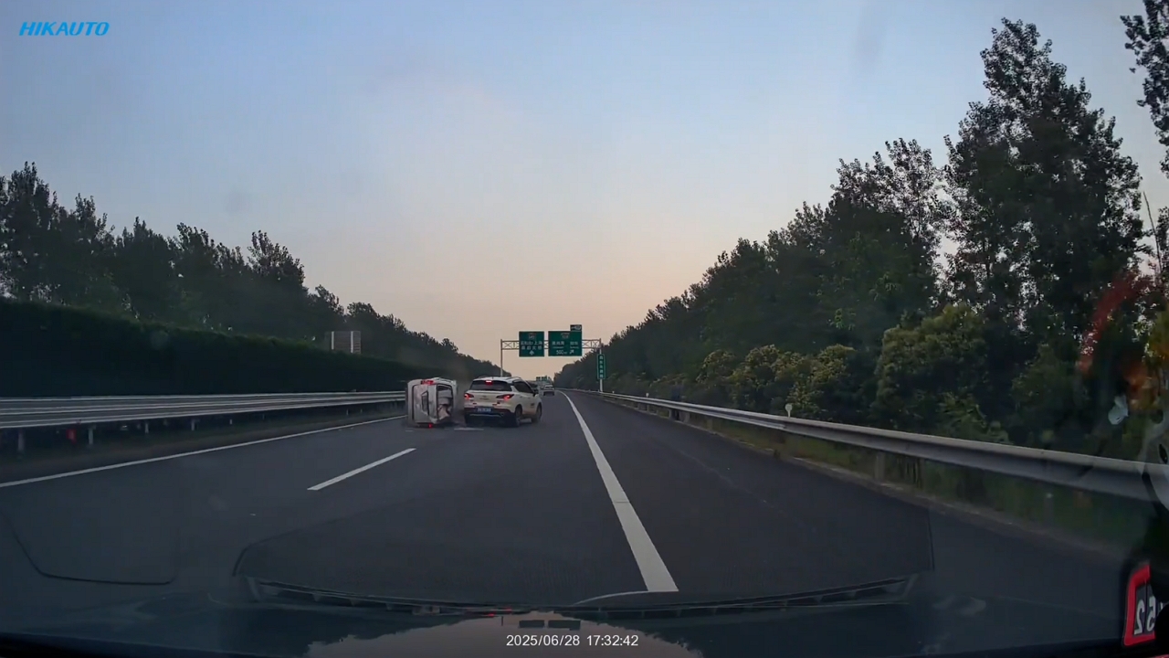 Video thumbnail for White Car Crashes Into Overturned Van on Shanghai Highway