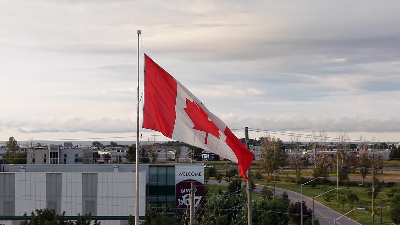 Video thumbnail for Canada: Canadian Flag at Sunrise Over Markham, Ontario 2.