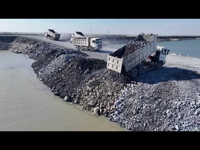 Video thumbnail for Processing Filling Stone to Large Area Use Bulldozer Push Stone and Dump Truck Transport Stone Fi