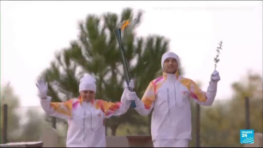 Video thumbnail for Olympic flame begins its weather-hit journey to Milan-Cortina 2026