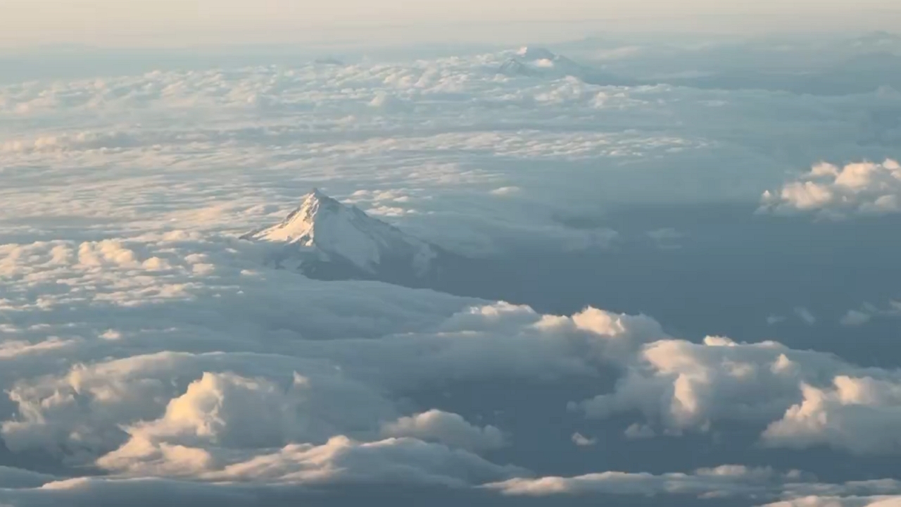 Video thumbnail for Sunset Aerial View of Snowy Mount Hood from Portland Flight