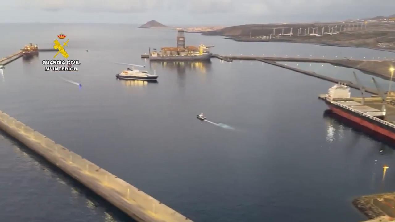 Video thumbnail for Spain: Virus-linked cruise ship arrives at Port of Granadilla under security operation.