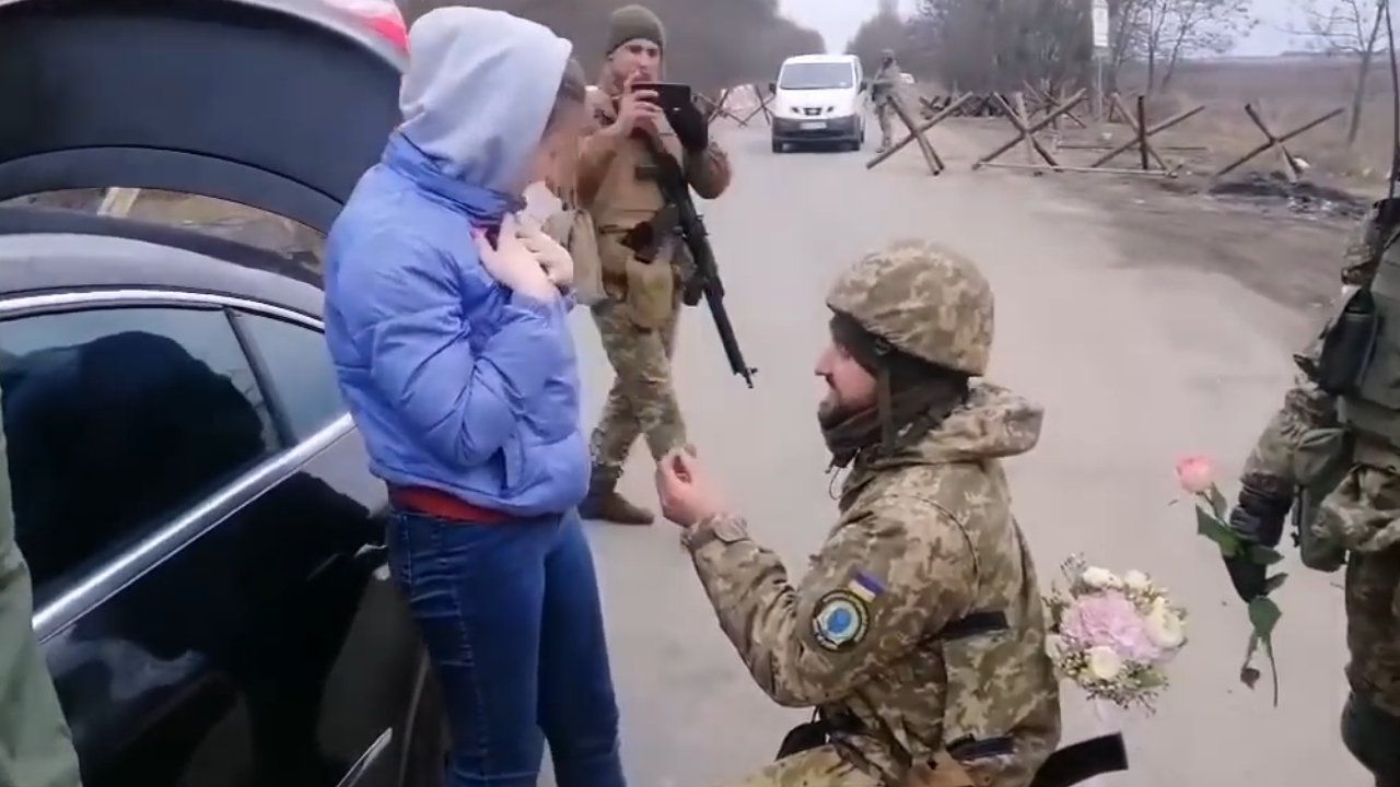 Video thumbnail for Ukrainian soldier proposes to woman at checkpoint during conflict