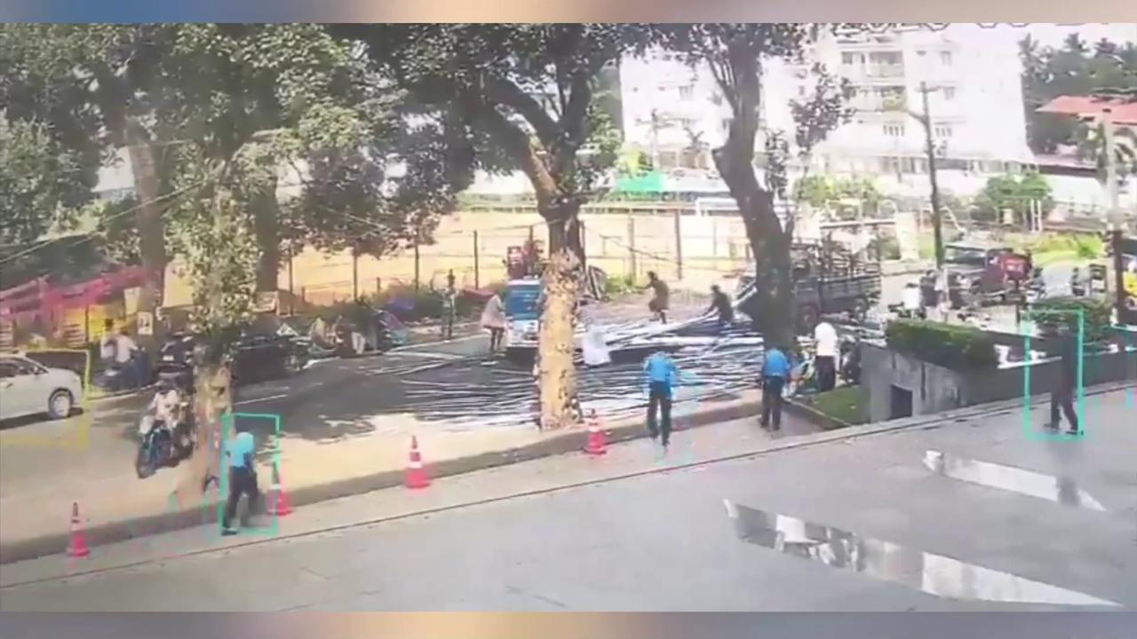 Video thumbnail for India: 10-metre iron pipes fall from pickup van, motorcyclist struck during sudden roadside mishap.