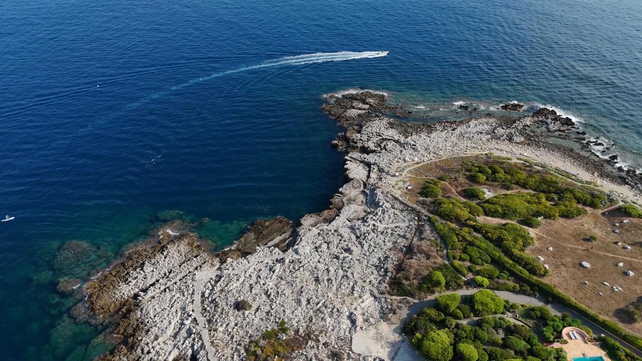 Video thumbnail for France: French Riviera drone footage captures Cap d’Antibes.