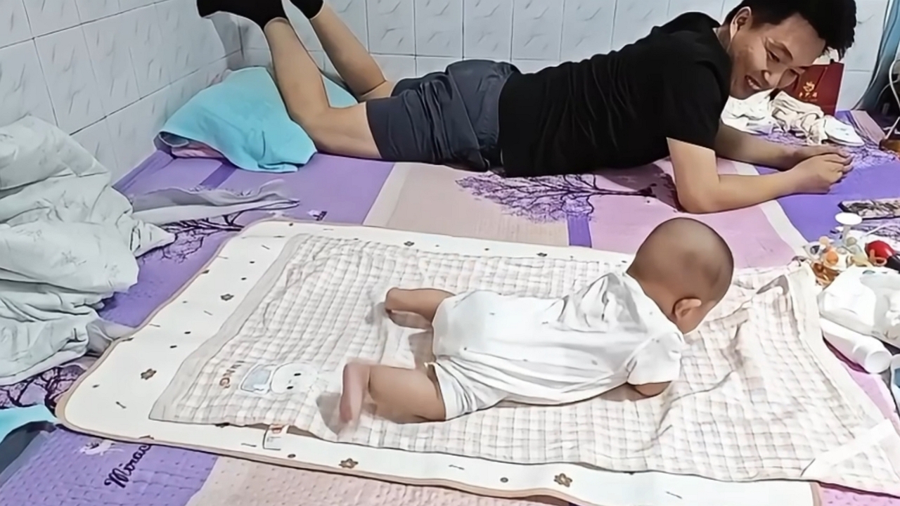 Video thumbnail for Baby Copies Dad Learning to Roll Over!