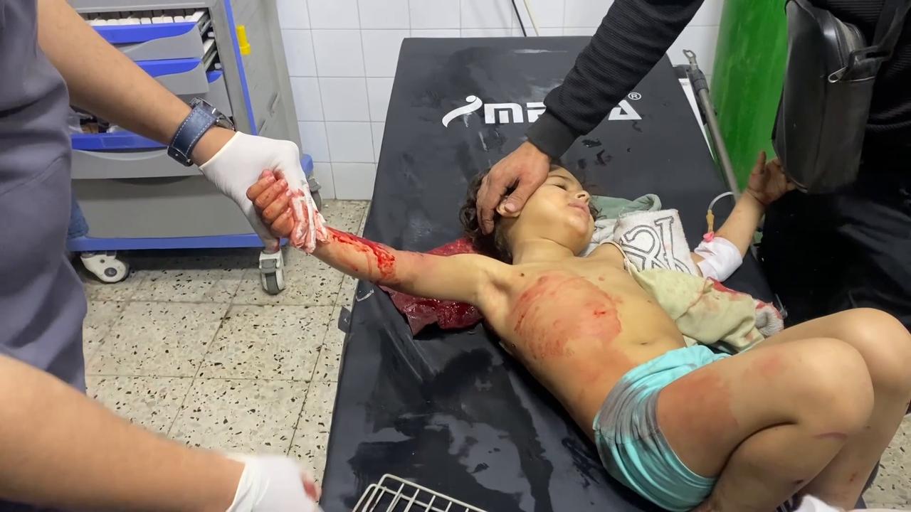 Video thumbnail for Injured children brought to Gaza hospital following Israeli strike.