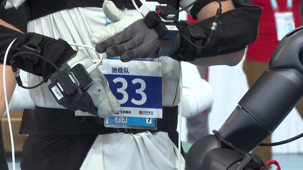 Video thumbnail for China: Robots race to unpack boxes at Humanoid Robot Games, showcasing delicate manipulation.