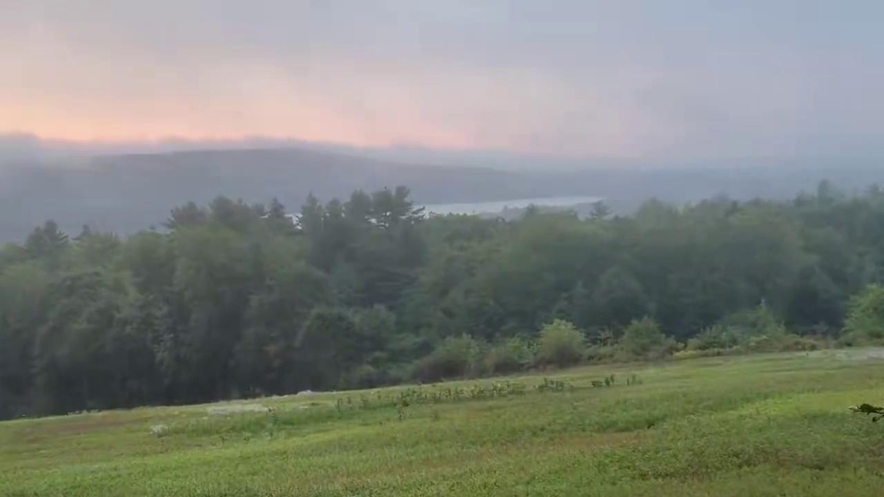 Video thumbnail for US: Maine Sunrise Glows Orange And Gold As Fog Covers The Valley.