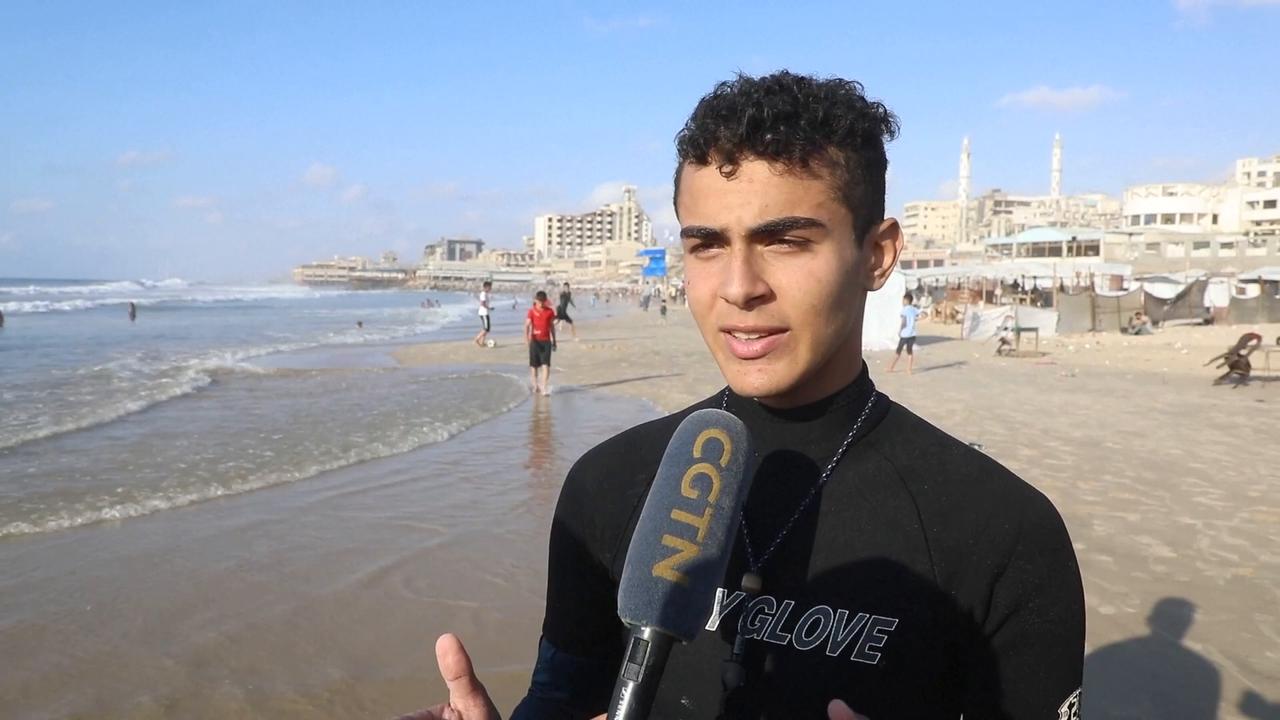 Video thumbnail for Surfers in war-torn Gaza find rare moments of joy by taking to waves.