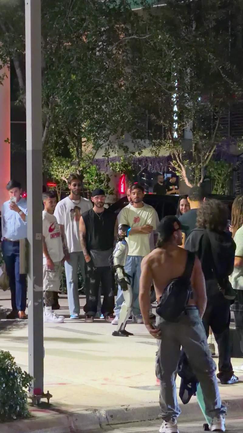 Video thumbnail for Humanoid Robot Strolling through Brickell Nightlife Crowd