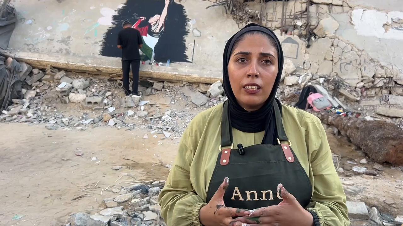 Video thumbnail for Palestinian artists honor Macklemore with mural amid Gaza destruction.
