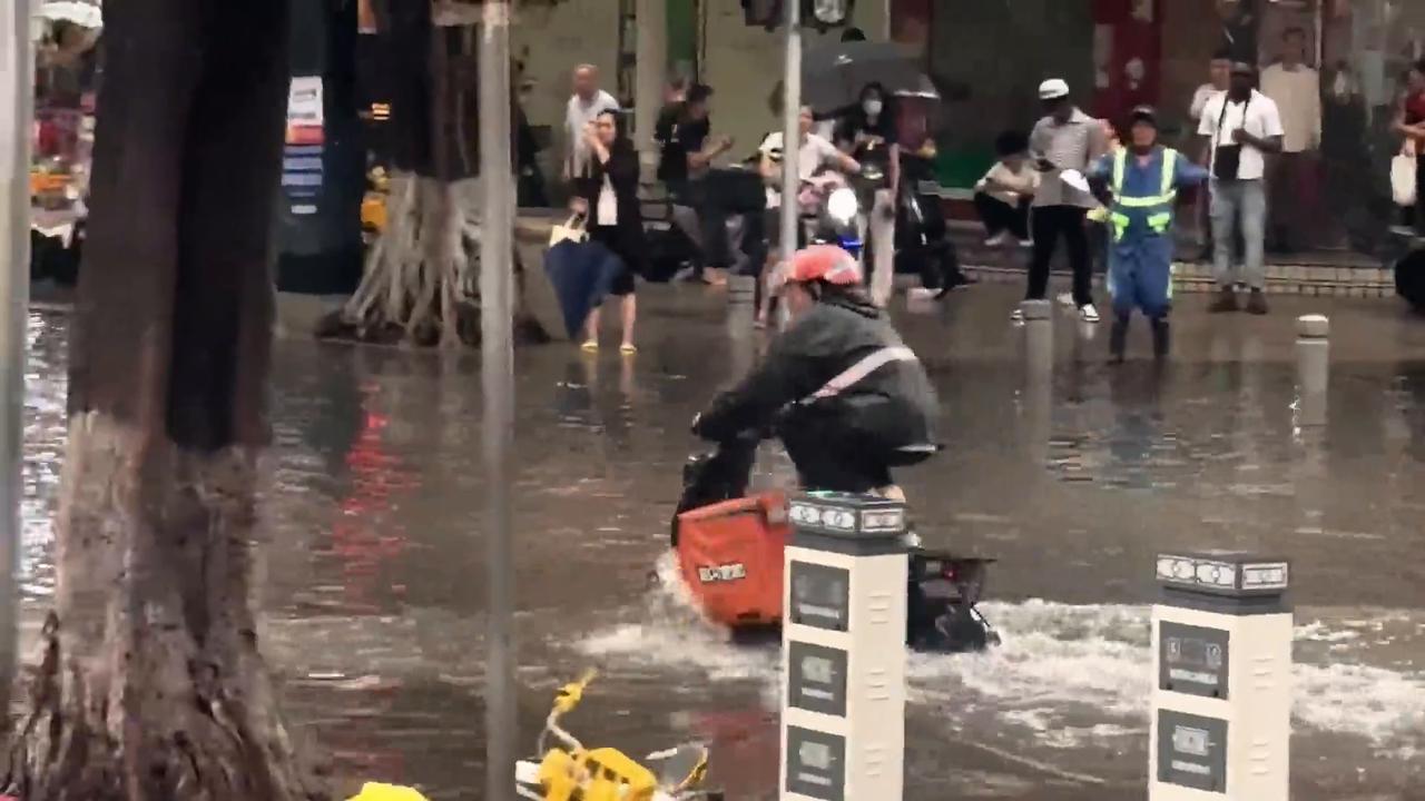 Video thumbnail for China: Delivery Rider Navigates Flooded Streets.