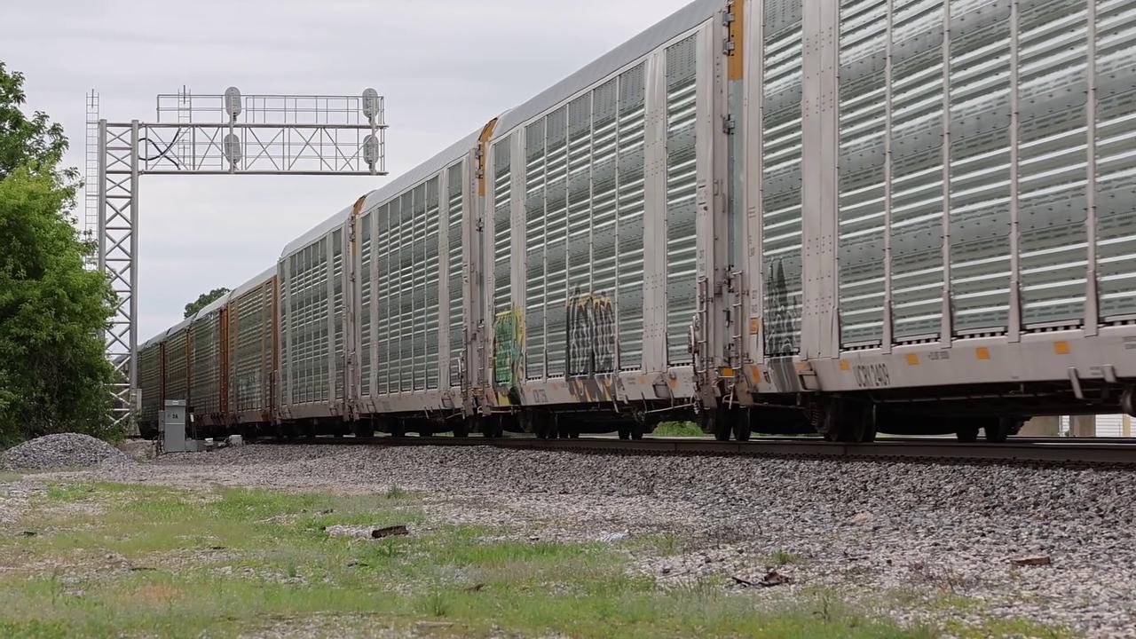 Video thumbnail for US: BNSF Freight Train with Automotive Carriers Passing Through Toluca, Illinois.