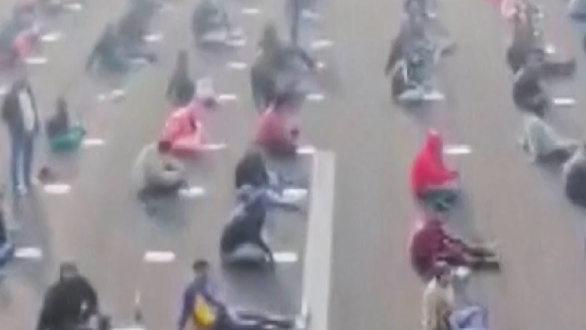 Video thumbnail for Thousands of candidates sit for government exam on airstrip in India