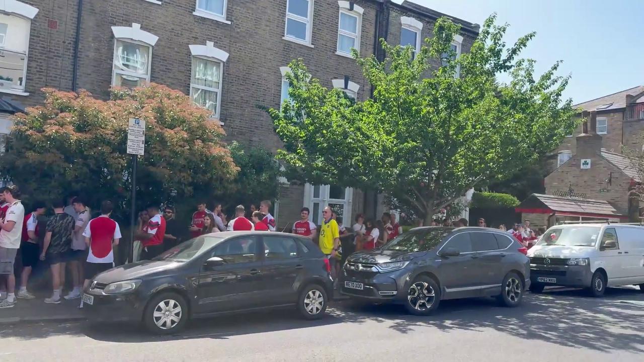 Video thumbnail for UK: Arsenal Fans Queue Spills Across Highbury Streets As Title Celebrations Continue In North London.