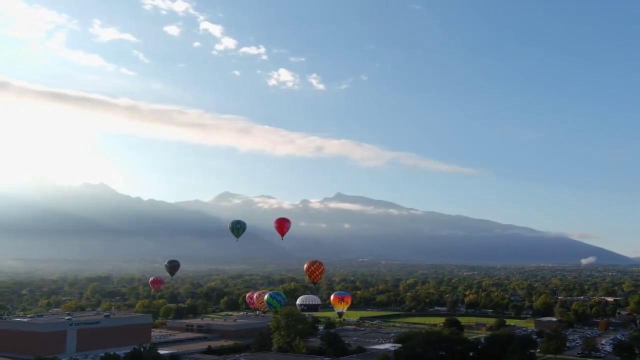 Video thumbnail for US: Colorful Hot Air Balloons Fill The Sky Over Utah Valley.