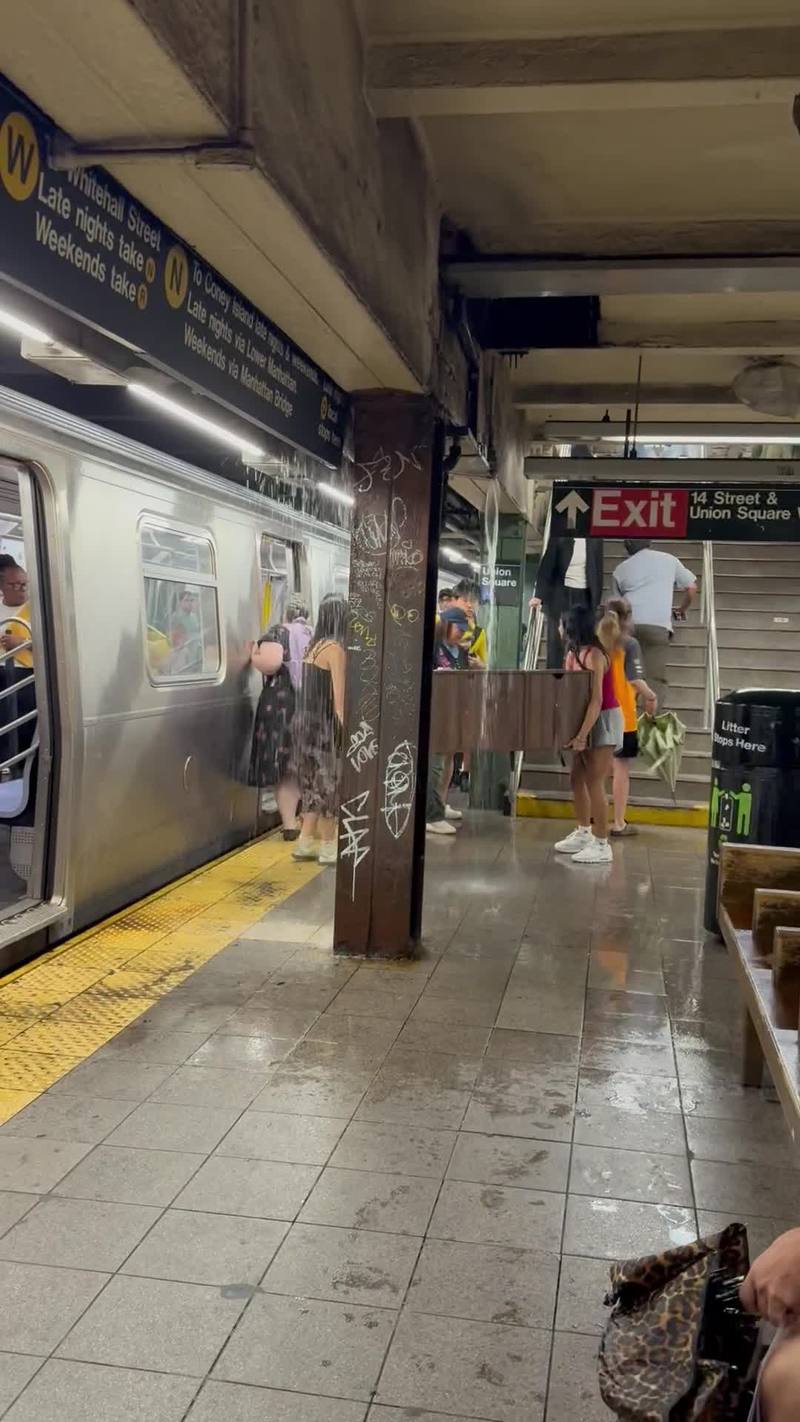 Video thumbnail for Carrying a Cabinet through a Flooded NYC Subway Station