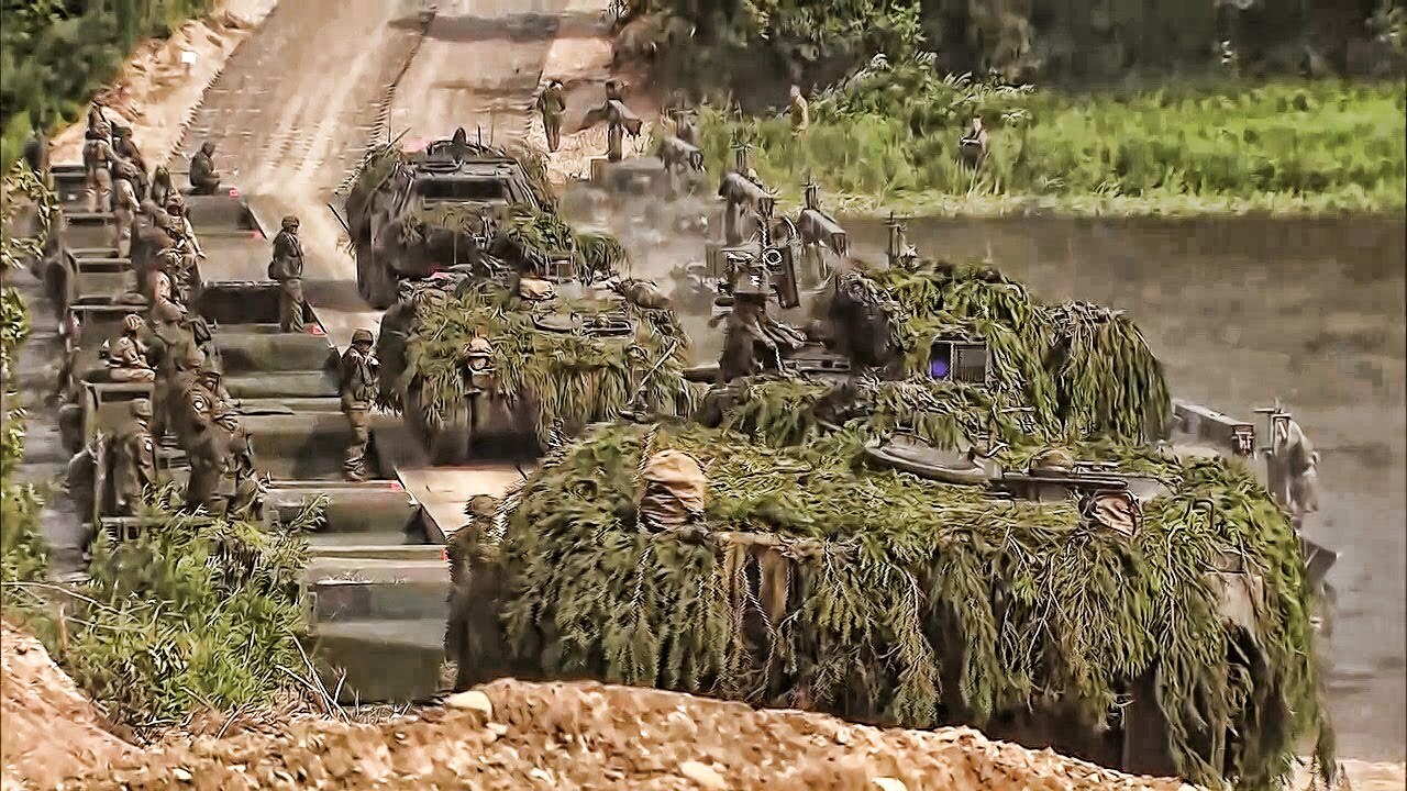 Video thumbnail for NATO Armored Vehicles Cross River On Pontoon Bridge