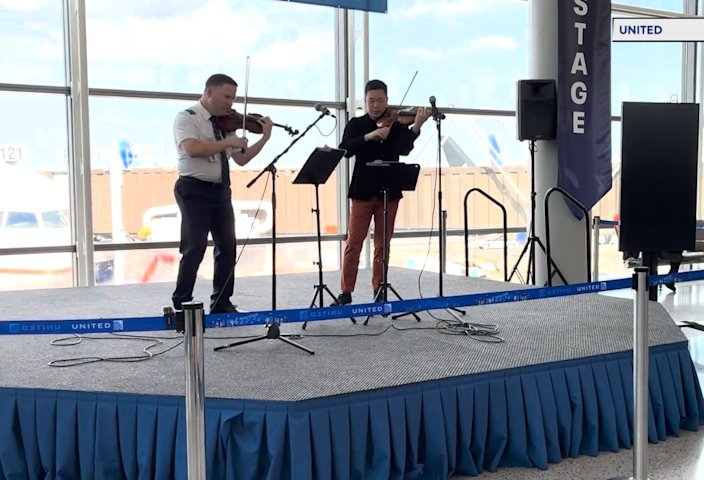 Video thumbnail for World-class violinists surprise travelers with performance at Newark Airport