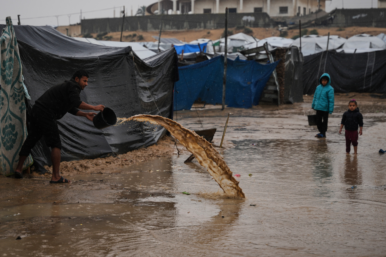Video thumbnail for Storm worsens living conditions: A families dig trenches to keep water out of tents