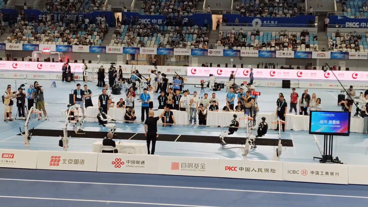 Video thumbnail for China: Humanoid robots show strength and strategy in tug of war contest in China.