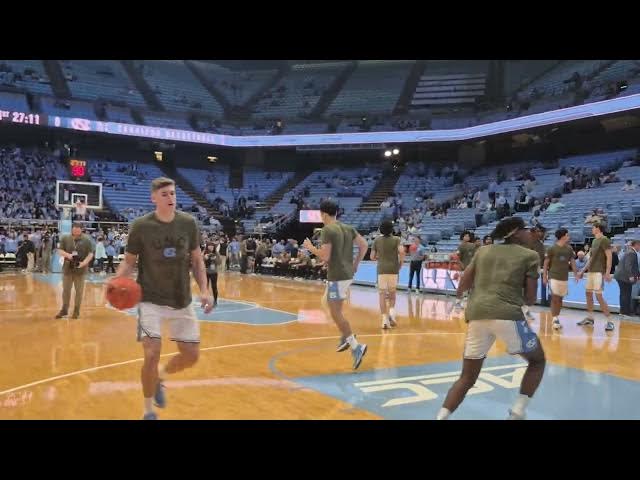 Video thumbnail for #UNC team comes out for warmups to "Here Comes Carolina," wearing green shirts on Veterans Day.