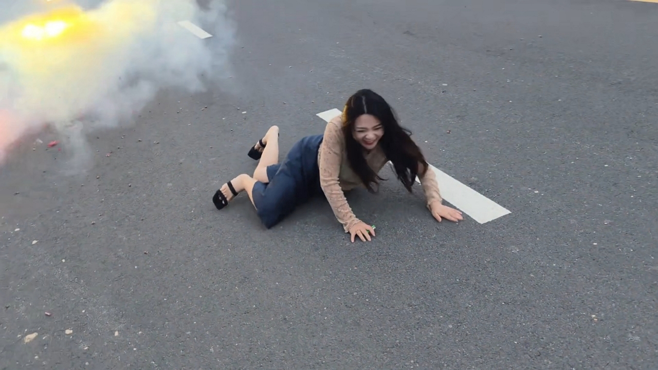 Video thumbnail for Woman Trips While Running from Firecrackers in Henan
