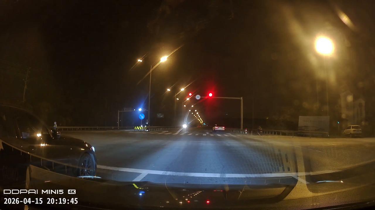 Video thumbnail for China: Two white cars narrowly avoid collision in smooth turn in China.