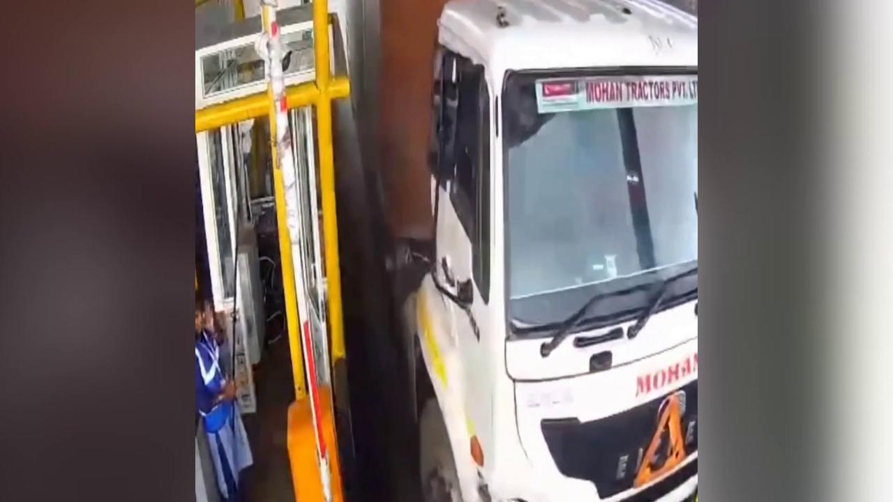 Video thumbnail for India: Speeding container truck crashes into stationary car, major accident averted.