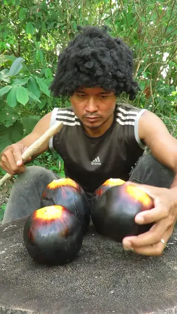 Video thumbnail for Survival Skills_ Roasted whole palm fruits #survival #outdoors #camping
