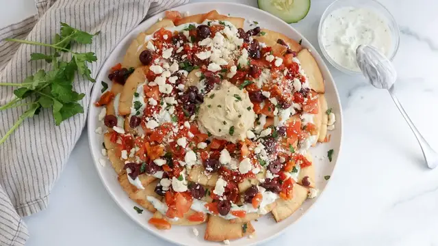 'Video thumbnail for Loaded Mediterranean Nachos Recipe'