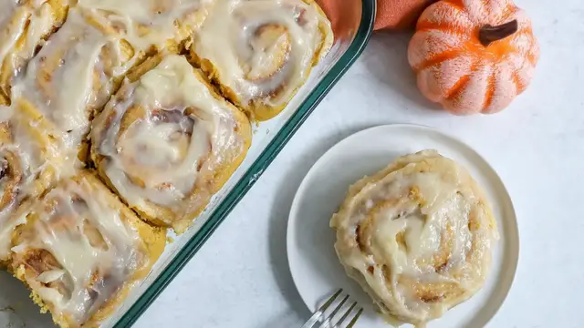 'Video thumbnail for Fall-Worthy Pumpkin Cinnamon Rolls With Cream Cheese Frosting Recipe'