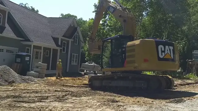 Video thumbnail for Excavator Unloading Precast Concrete Retaining Wall Blocks