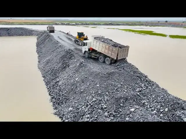 'Video thumbnail for Amazing Filling Stone Addition the Road in Flooded Areas Use Bulldozer and Dump Truck in Processi'