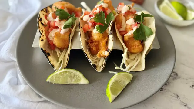 Video thumbnail for Baja-Style Fish Tacos With Crunchy Slaw And Tangy Lime Crema