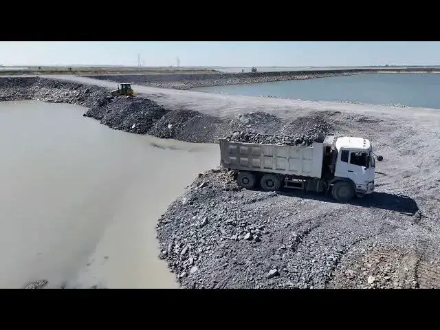 'Video thumbnail for Amazing Huge Lake Filling Stone Using Bulldozer Push Stone and Dump Truck Unloading Stone in Proc'