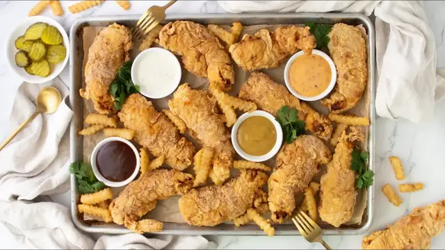 'Video thumbnail for These Extra Crispy Chicken Tenders Get Their Crunch From A Vodka Batter'