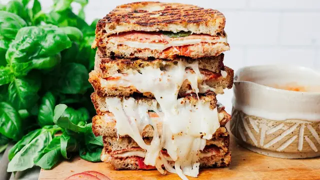 'Video thumbnail for Our Cast Iron Pizza Grilled Cheese Is Crisp, Melty, And Decadent'
