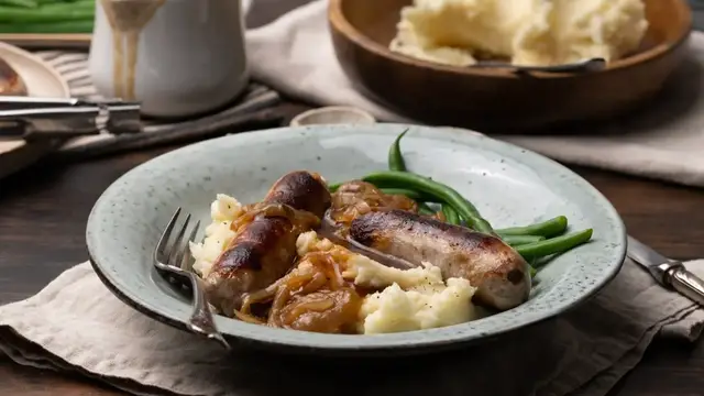 'Video thumbnail for Bangers And Mash With Stout Onion Gravy Recipe'