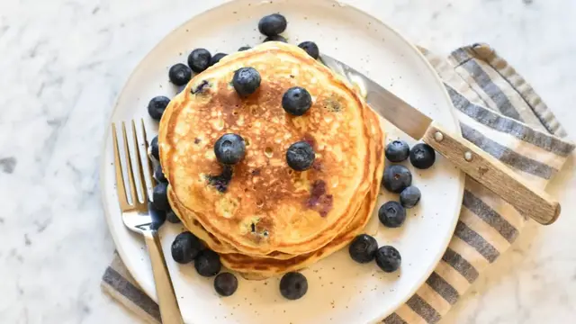 'Video thumbnail for Fluffy Blueberry Cornmeal Pancakes Recipe'