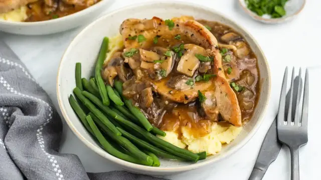 'Video thumbnail for Savory Boneless Pork Chops And Mushroom Gravy Recipe'