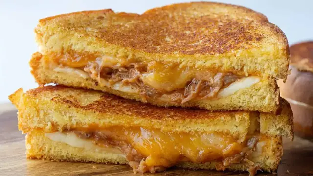 'Video thumbnail for Smoky Pulled Pork Grilled Cheese Recipe'