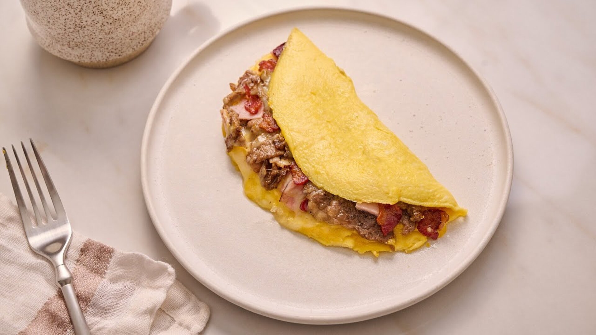 Video thumbnail for Start Your Morning Off Right With A Meat Lover's Omelette Recipe