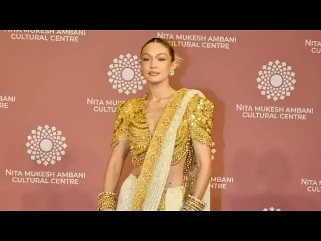 'Video thumbnail for Gigi Hadid Shines in an Ornate Golden Saree at NMACC Gala event'