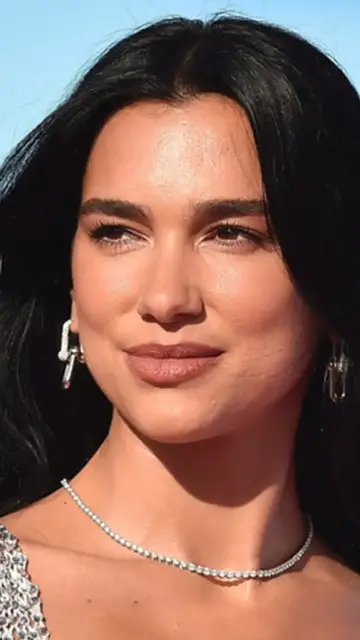 Video thumbnail for Dua Lipa Ditches Traditional Wedding Dress For Bridal Suit Inspired By This 70s Icon