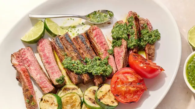 'Video thumbnail for The Ultimate Cast Iron Flank Steak (And Chimichurri!) Is Only 20 Minutes Away'