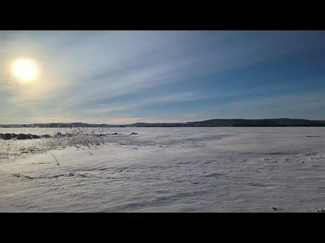 Video thumbnail for Sunny Day over the frozen lake in Sweden.
