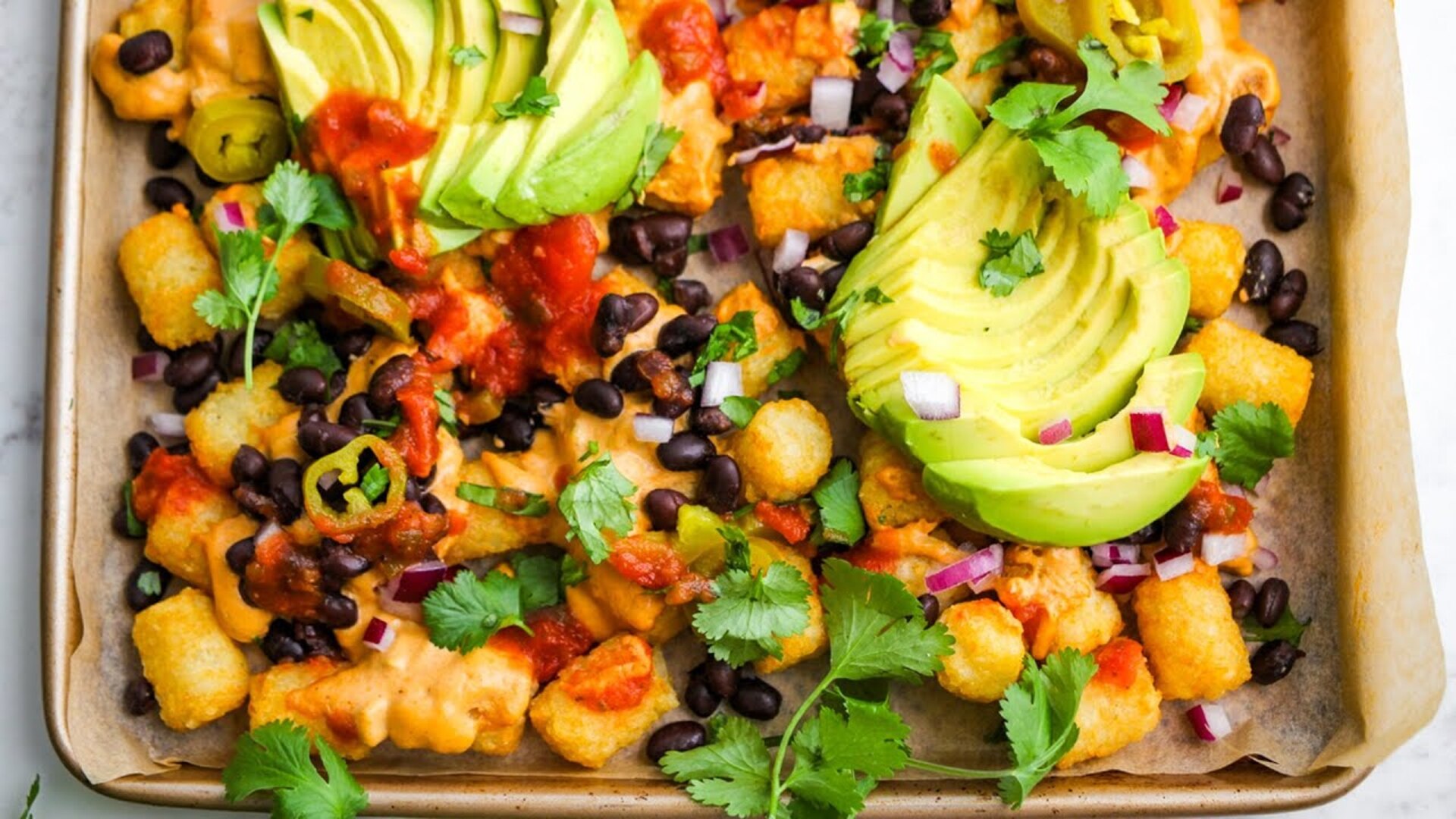 Video thumbnail for Vegan Loaded Tater Tots With Cashew Queso Recipe