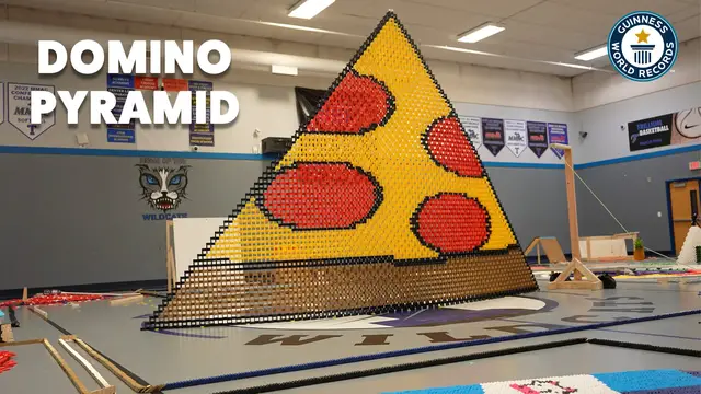 'Video thumbnail for Building the world’s tallest 2D domino pyramid, 8,122 dominoes'